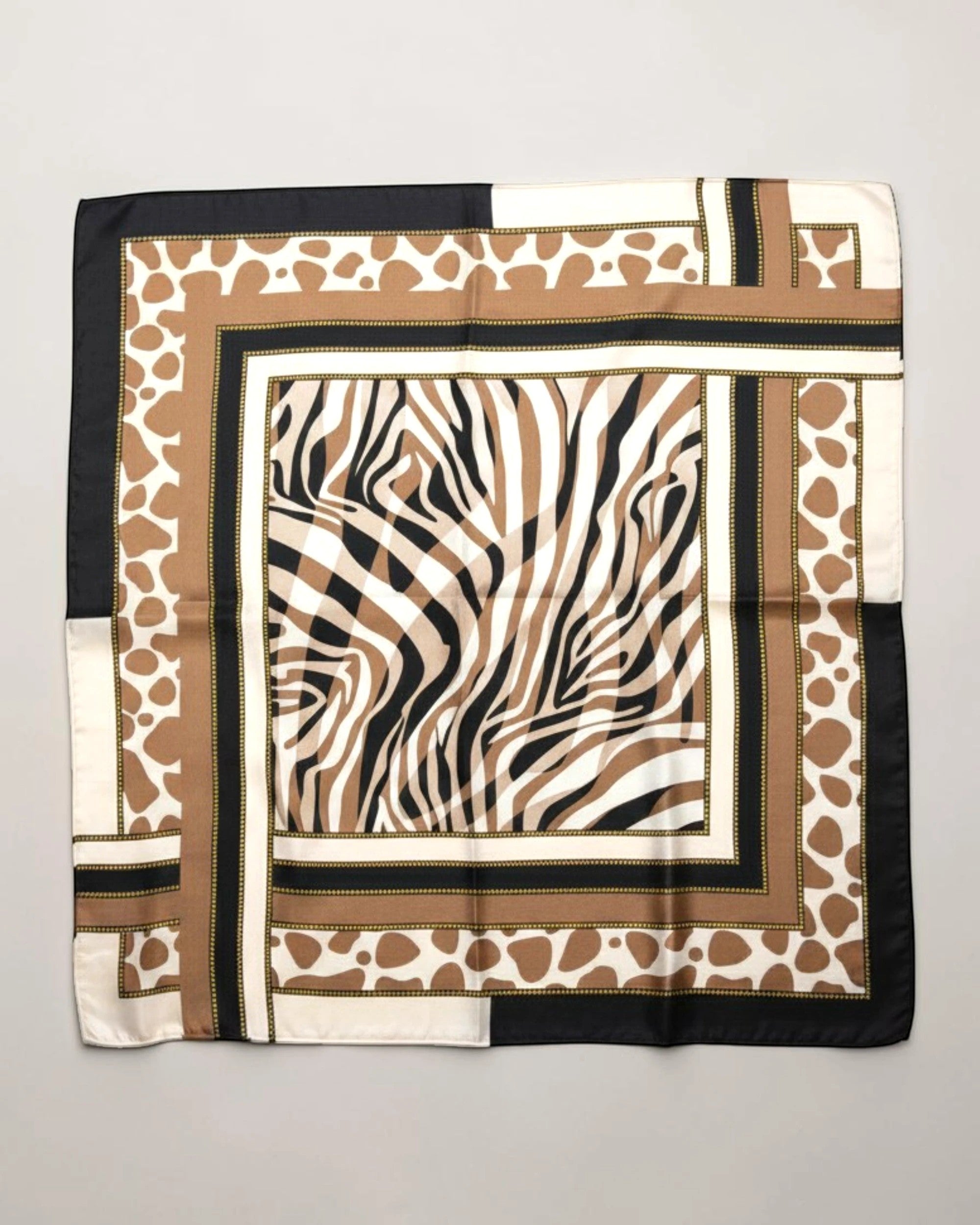 APA Studios Savana foulard scarf with zebra print center and giraffe print border in brown, black, and white.