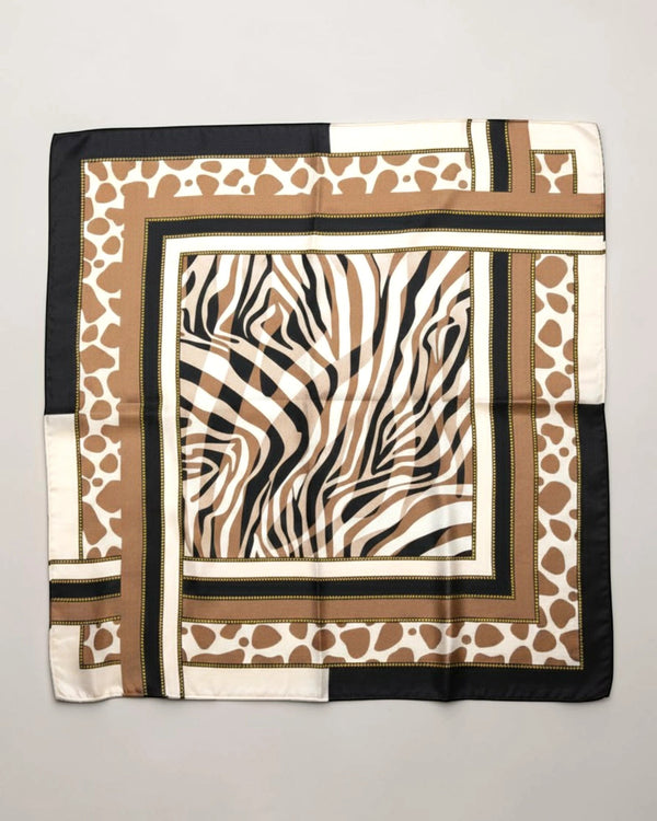 APA Studios Savana foulard scarf with zebra print center and giraffe print border in brown, black, and white.